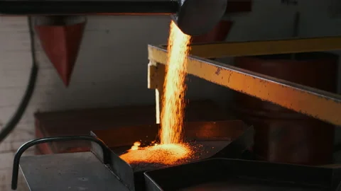 Molten flowing material, worker working in chemical production factory. Stock Footage 143030952