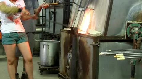 Molten glass on pipe Stock Footage 12319653