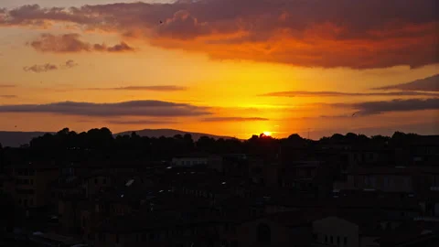 Molten Horizon Bathing Tuscan Rooftops in Evening Light Stock Footage 256220709