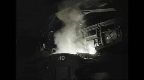 Molten iron flowing down into cauldron Stock Footage 44571636