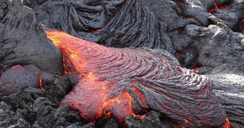 Molten lava close-up motion magma flow nature mountain volcano footage Stock Footage 336579820