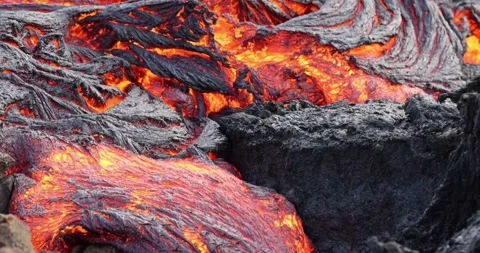 Molten lava close-up motion magma flow nature mountain volcano footage Video stock 336579941