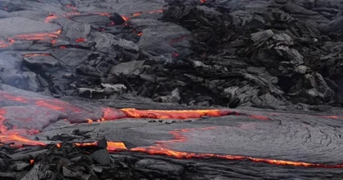 Molten lava flowing close up surface cold flow Hawaii Volcanoes magma Video stock 336580210