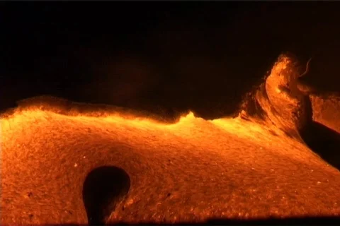 Molten lava oozes from a volcano, erupting eerily into domes Stock Footage