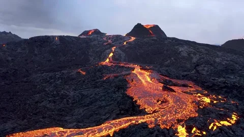 Molten Lava River Flowing Down a Volcanic Slope from an Erupting Crater Stock-Footage 341213496