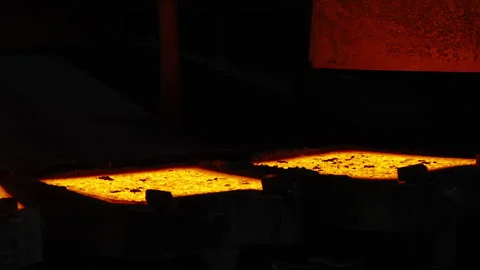 Molten Metal Glowing in Casting Molds at Industrial Foundry Stock Footage 346226379