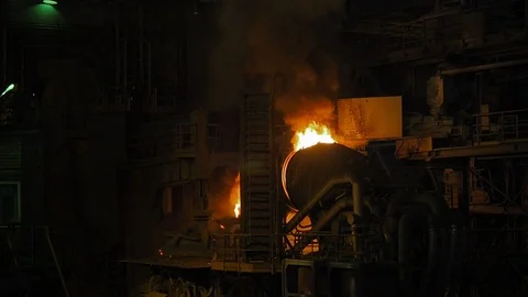 Molten metal pouring. Casting liquid metal. Molten metal melted in furnace at Stock Footage 113077591