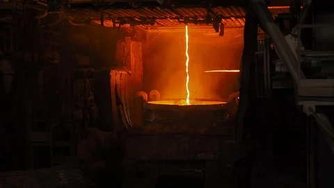 Molten metal pouring. Casting liquid metal. Molten metal melted in furnace at Stock Footage 113077683