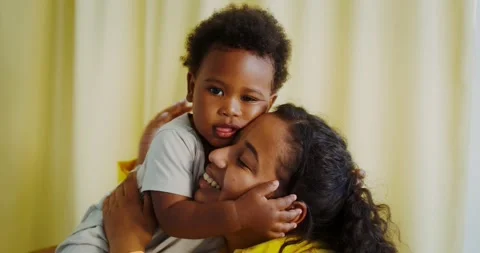 Mom and baby cuddle indoors Stock Video Pond5