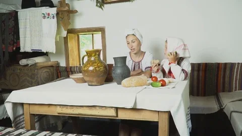 Mom and daughter are at the table Stock Footage