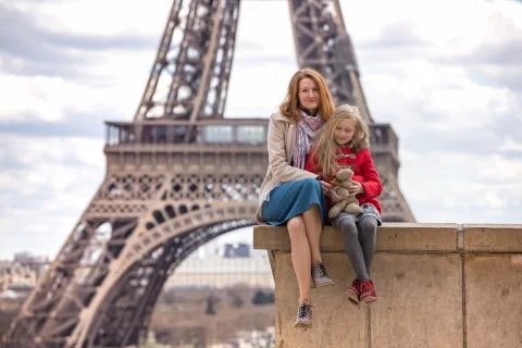 Mom and daughter on the background of the Eiffel Tower Stock Photos