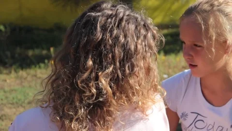 Mom and daughter embrace Stock Footage