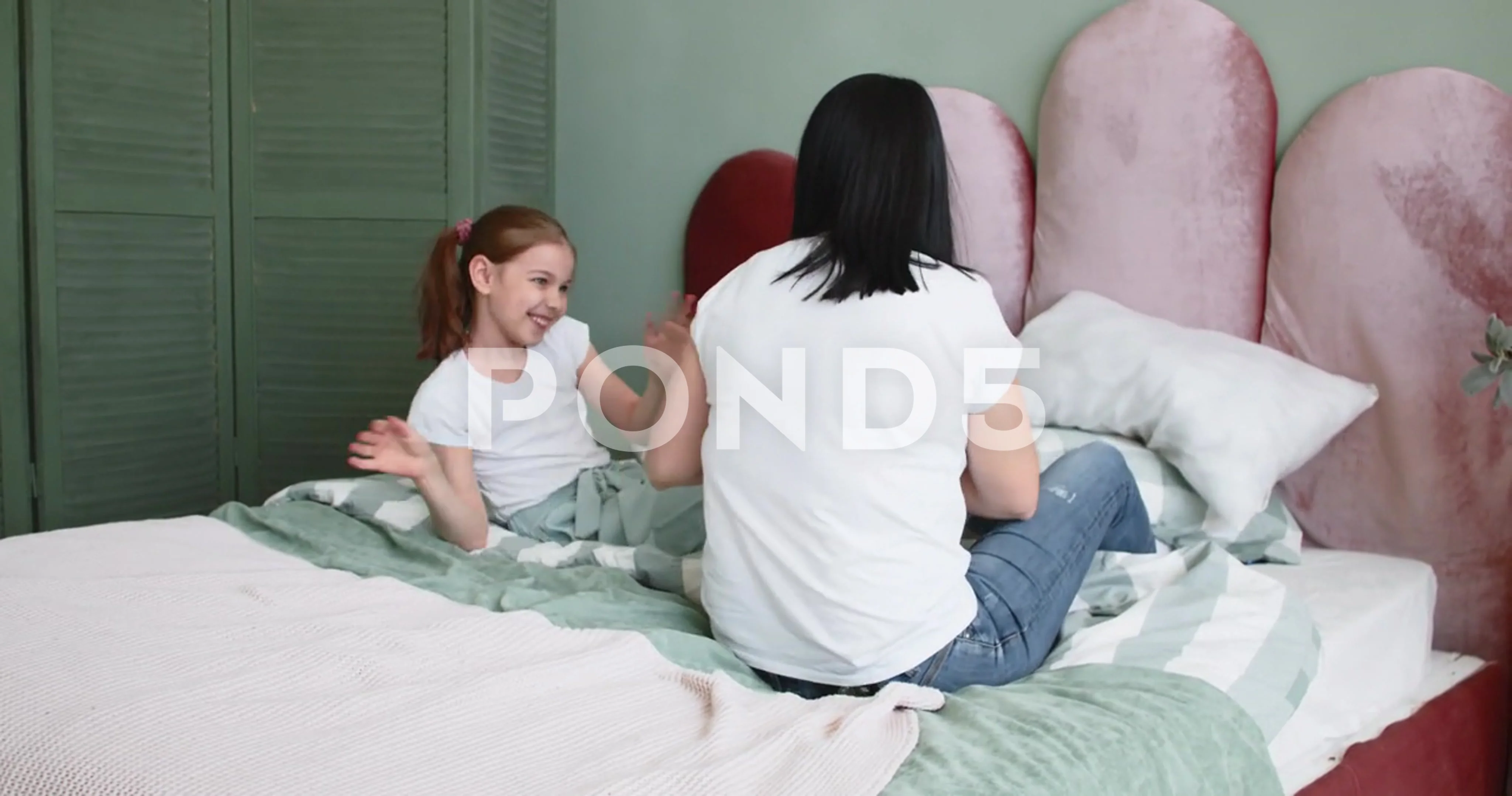 Mom and daughter a play at home