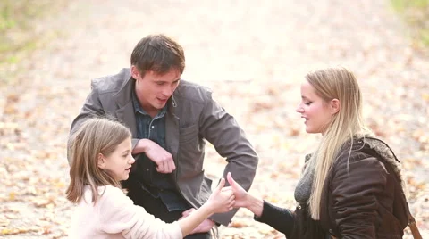 Mom and daughter playing game in the park Stock Footage 59554314