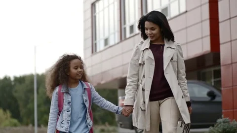 Mom and Daughter Walking into School Stock Footage