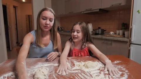 Mom and doc playing in the kitchen Stock Footage 107047207