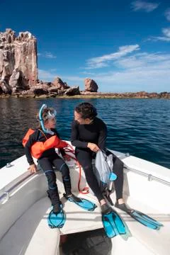 A mom and her son getting ready to snorkel at Espíritu Santo Island. Stock Photos