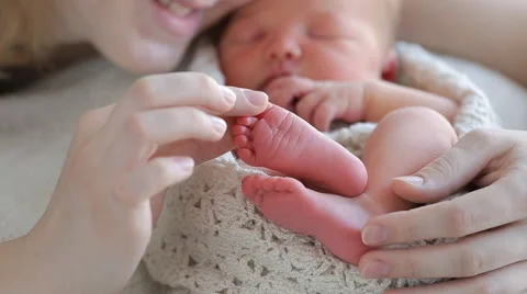 Mom and her Tiny Newborn Baby's Stock Footage 62632634