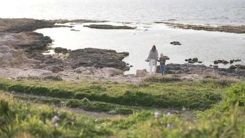 Mom and son are returning from a boat trip. Stock Footage 106868704