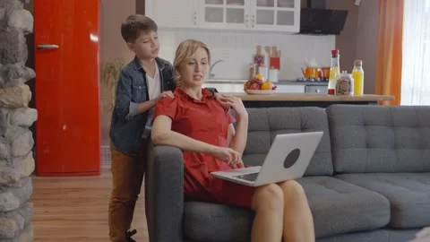 Mom and son are using laptop together. Stock Footage 148945220