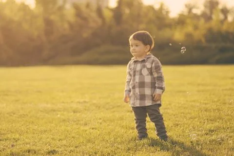 Mom and son have fun and make balloons from soap Stock Photos