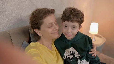 Mom and son make a selfie photos on her | Stock Video | Pond5
