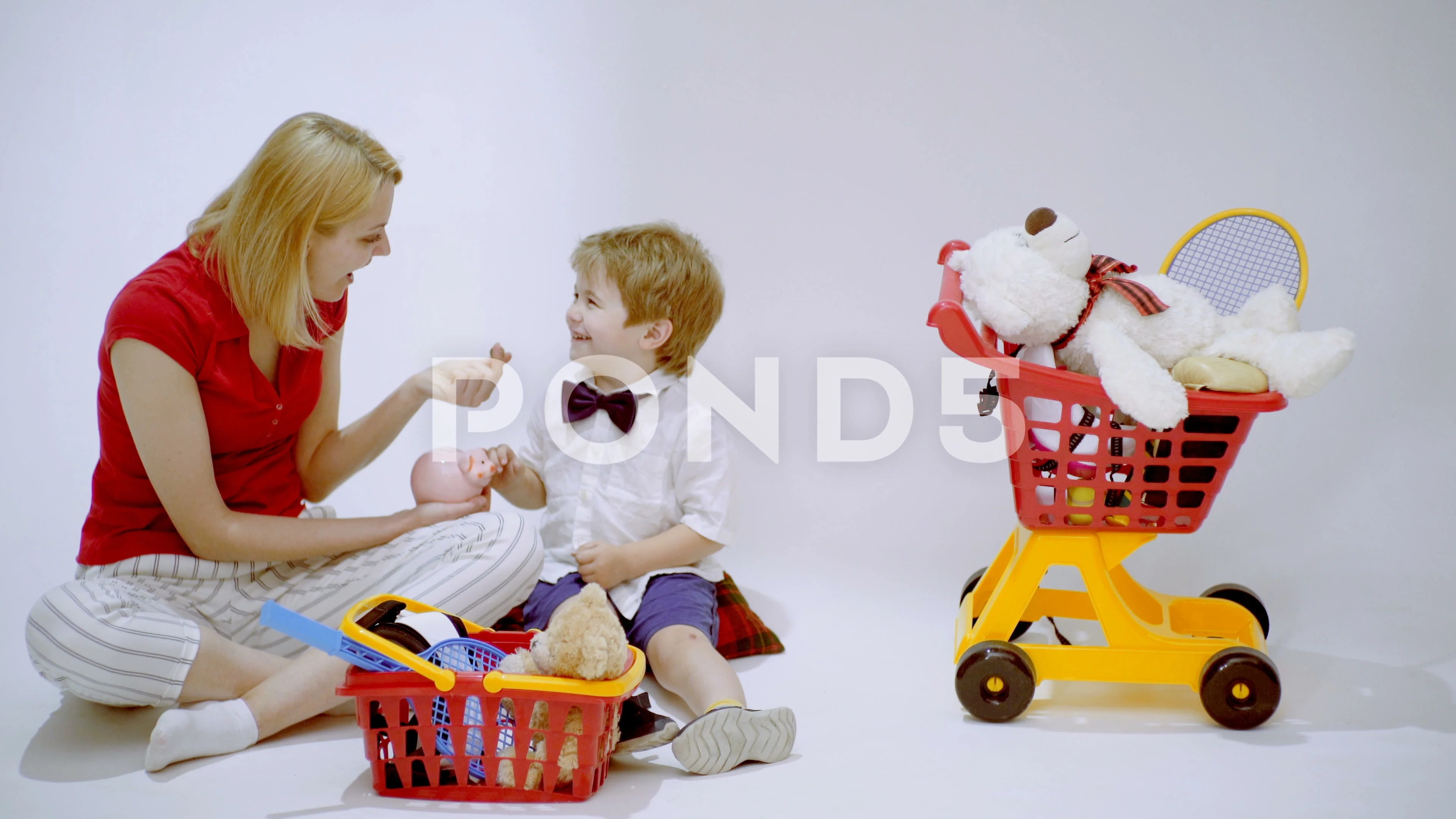 Mom and son playing shopping. Family shopping. Mother teaching her son  financial