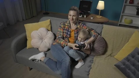Mom and young daughter playing video Stock Video Pond5