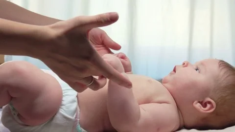 Mom with baby doing exercises Stock Footage