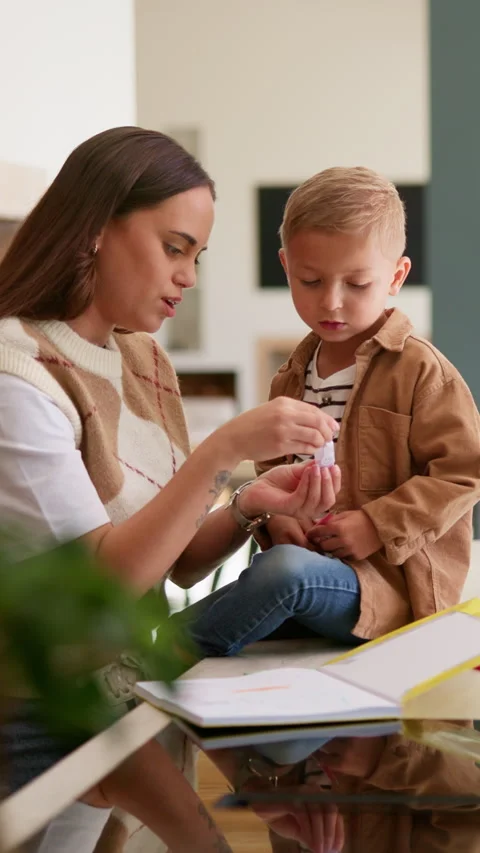 Mom, boy and learning with books in home for development, talk or show Stock Footage 336204853