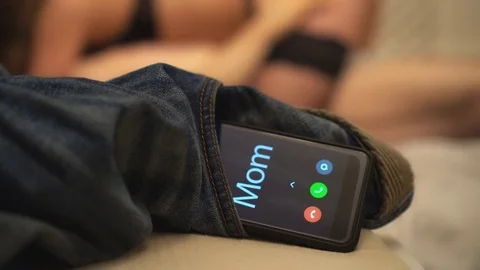 Mom calling at the wrong time. Stock Footage 83074895