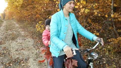 Mom with a child to ride a bicycle Stock Footage 59641163
