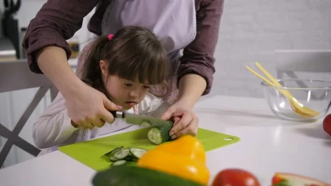 Mom developing motor skills of down syndrome child Video stock 98663640