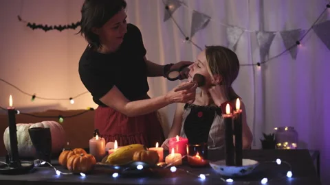 Mom Doing Spooky Halloween Makeup For Daughter Stock Footage 317982020
