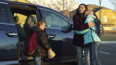 Mom drops kids off for school Stock Footage 46738509