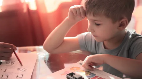 Mom helping his son to do his homework  Stock Footage 58808322