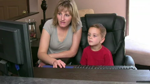 Mom Helping Son Computer Stock Footage 522070