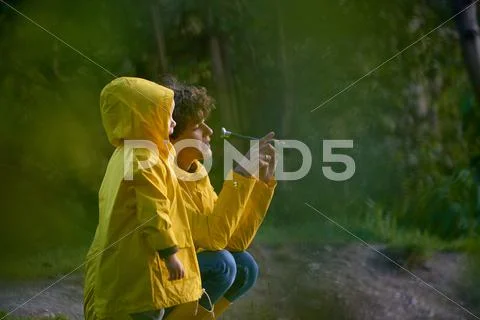 Mom with her daughter looking into the distance through a spyglass Stock Photos