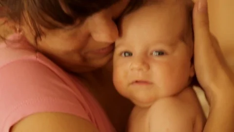 Mom holds a newborn baby in her arms Stock Footage