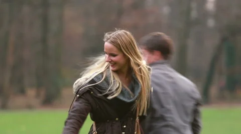 Mom playing with husband and daughter in park Stock Footage 59554521