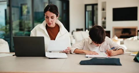 Mom, remote work and helping child with homework, multitasking or accountant Stock Footage 335531508