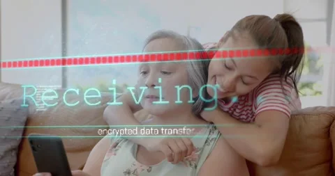 Mom sitting on couch receiving tech data on phone as daughter entering hugging Stock Footage 320895260
