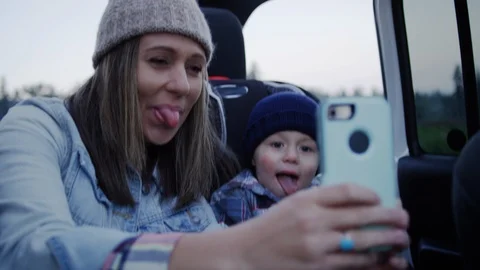 Mom Takes Silly Selfies With Her Cute So... Stock Video Pond5