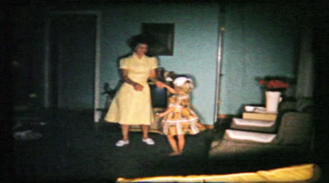 Mom teaches daughter dance steps at home 1950s vintage film home movie 155 Stock Footage