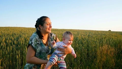 Mom throws up and catches her little daughter Stock Footage