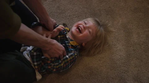 Mom Tickling Son Video stock 47342444