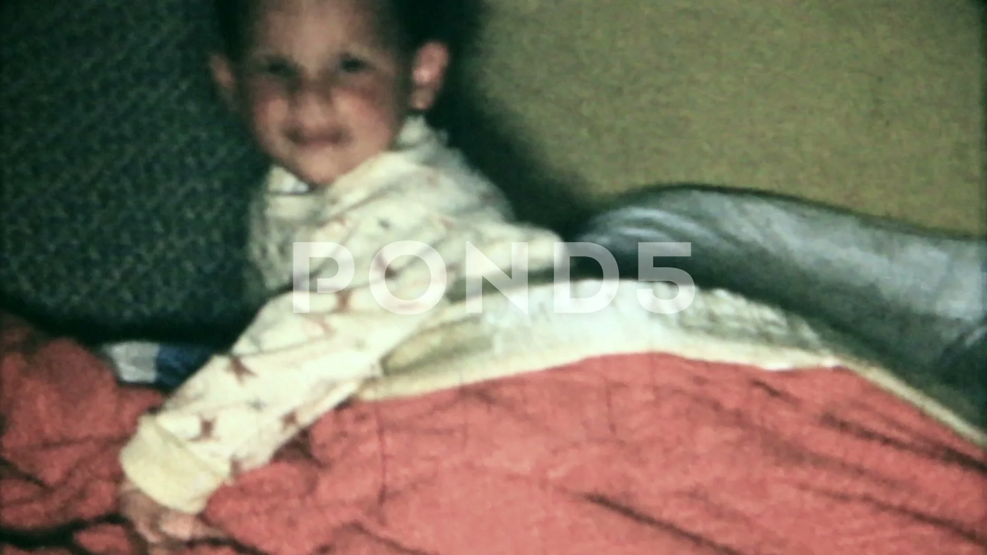 mom tucks her son into bed with a goodnight kiss 1950s family home movie  6479