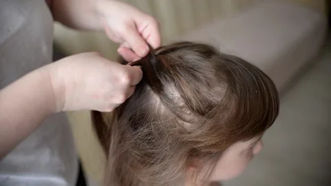 Mom Woman Makes The Hairstyle Of Her Dau Stock Video Pond5 Mom Woman Makes The Hairstyle Of Her Dau Stock Video Pond5