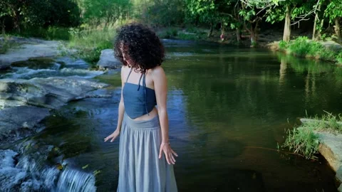 A Moment of Reflection: Capturing Serenity and Natural Beauty by the Water as a Stock Footage 314305030