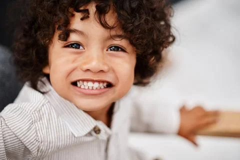 Mommy says we should all learn to smile more. Portrait of an adorable little boy Stock Photos
